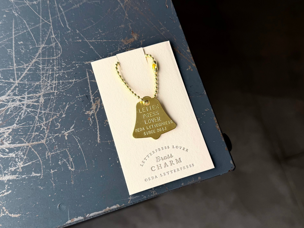 Brass charm